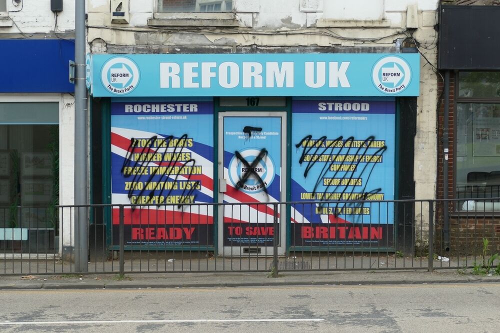 Reform UK shop front grafitti