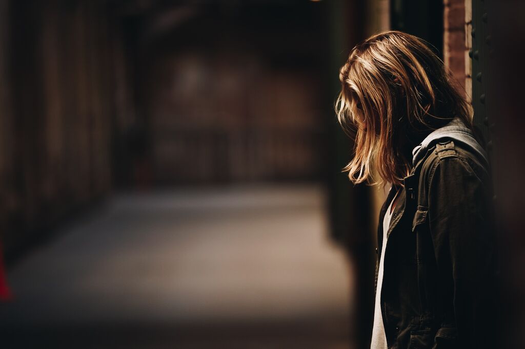 Woman with her head bowed