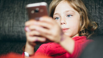 young girl on a mobile