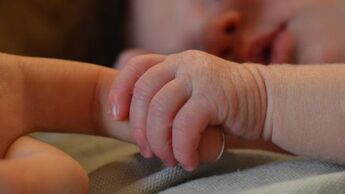 Baby holding mothers hand 4 0