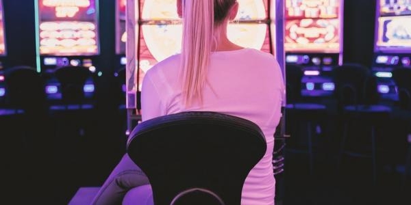 Female sat in front of gambling machines 1 2