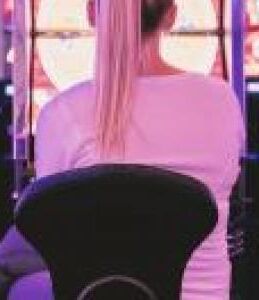 Female sat in front of gambling machines 0 1a