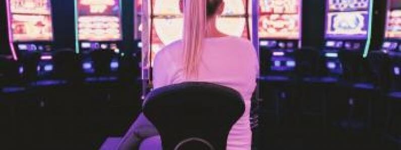 Female sat in front of gambling machines 0 1a