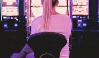 Female sat in front of gambling machines 0 1a