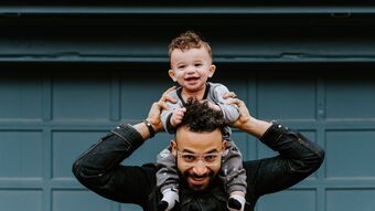 Dad with child on his shoulders