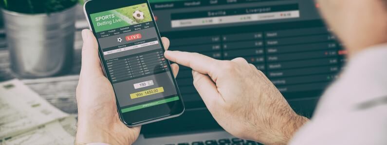 Football gambling online smartphone laptop 0