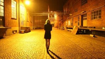 Woman walking alone night 0