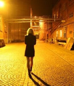 Woman walking alone night 0