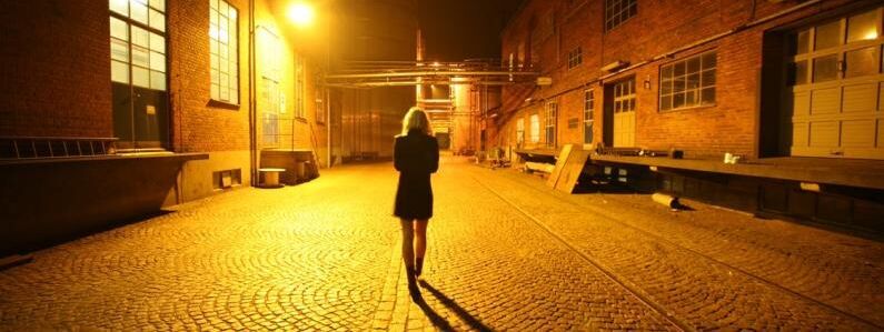 Woman walking alone night 0