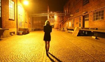 Woman walking alone night 0