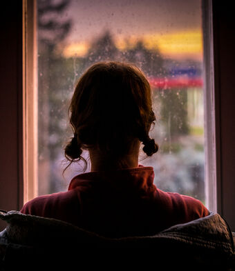 Woman looking out window silhouette exploitation small