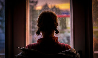 Woman looking out window silhouette exploitation small