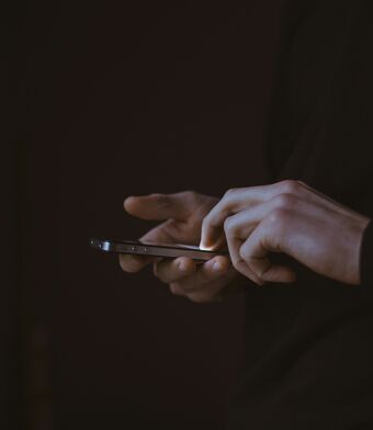 Phone in hand dark