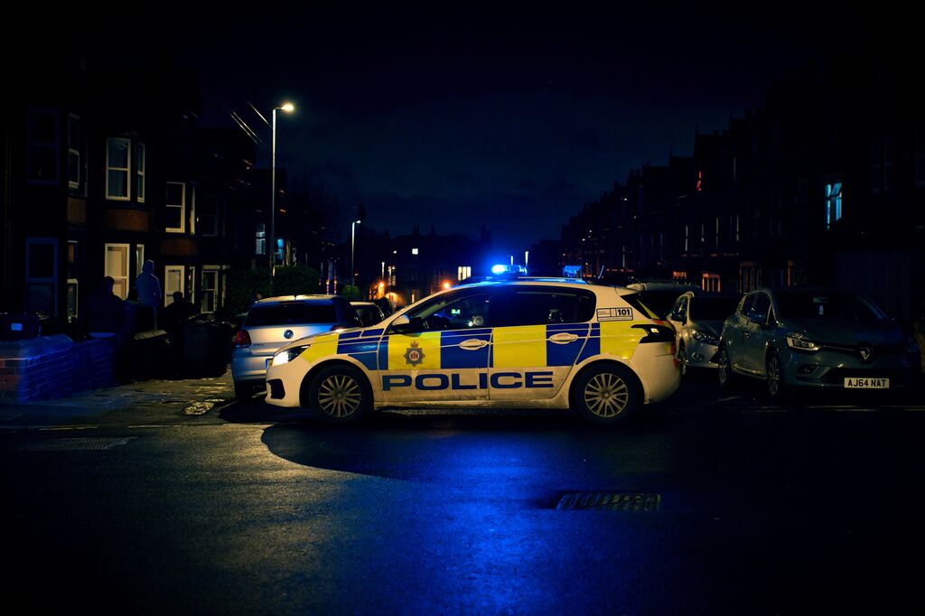 Police car nighttime protest unrest