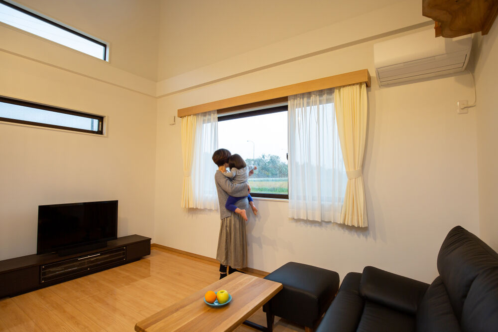 Woman looking out of window 2