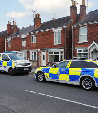 Police outside house street arrest