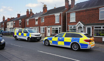 Police outside house street arrest