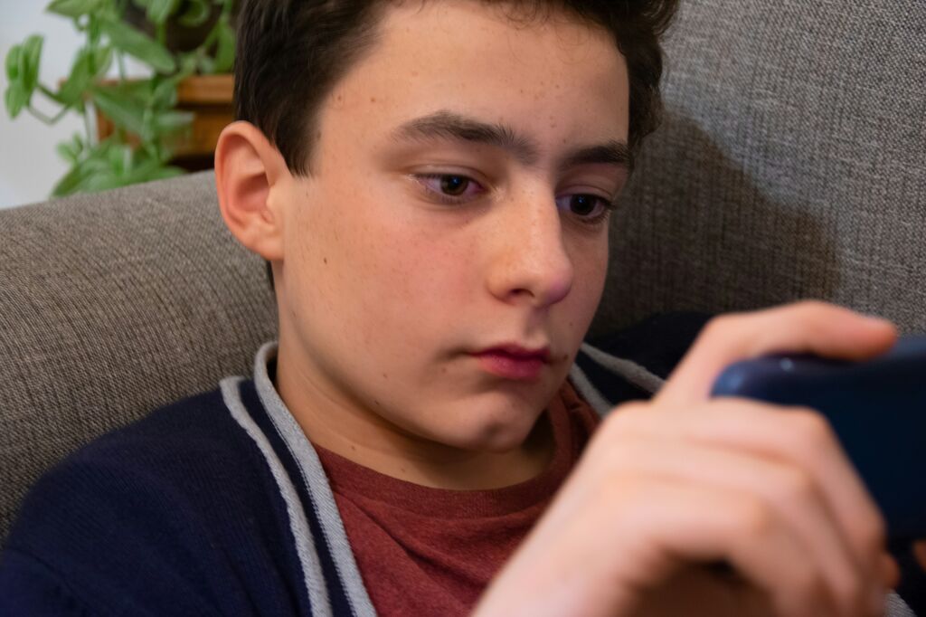 Teenage boy on phone