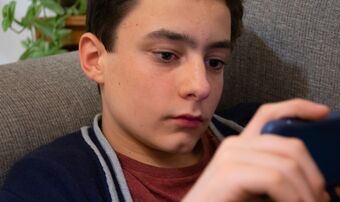 Teenage boy on phone