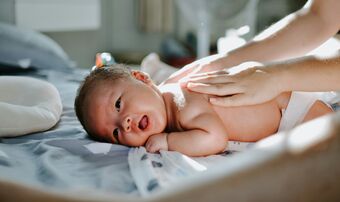 Baby on hospital bed