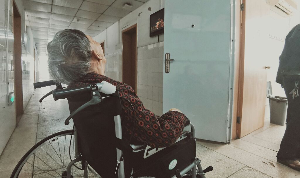 Elderly man in wheelchair