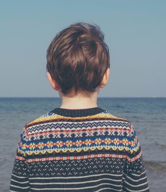 Boy looking out into ocean