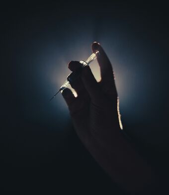 Syringe in hand