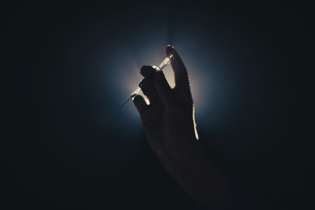Syringe in hand