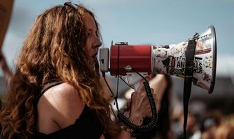 Young woman with megaphone