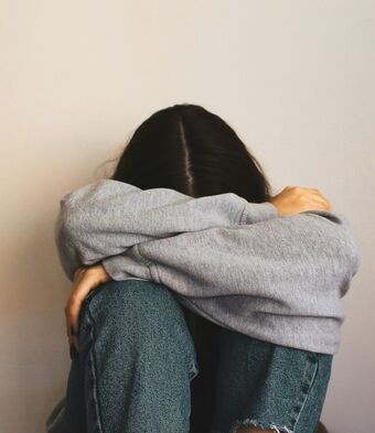 Woman head in hands