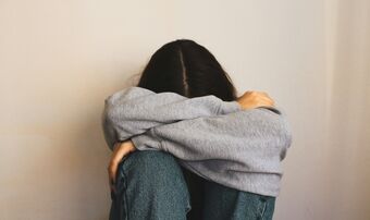 Woman head in hands
