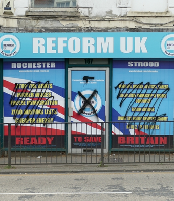 Reform UK shop front grafitti