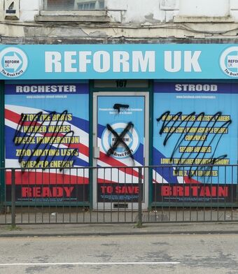 Reform UK shop front grafitti