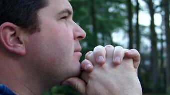 Man praying in woods 2c